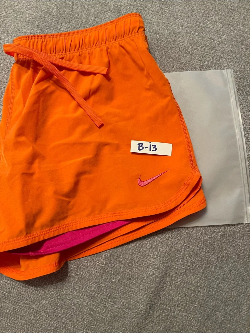 Nike Dri-FIT Women's Bright Orange Running Athletic Shorts with Pink Swoosh